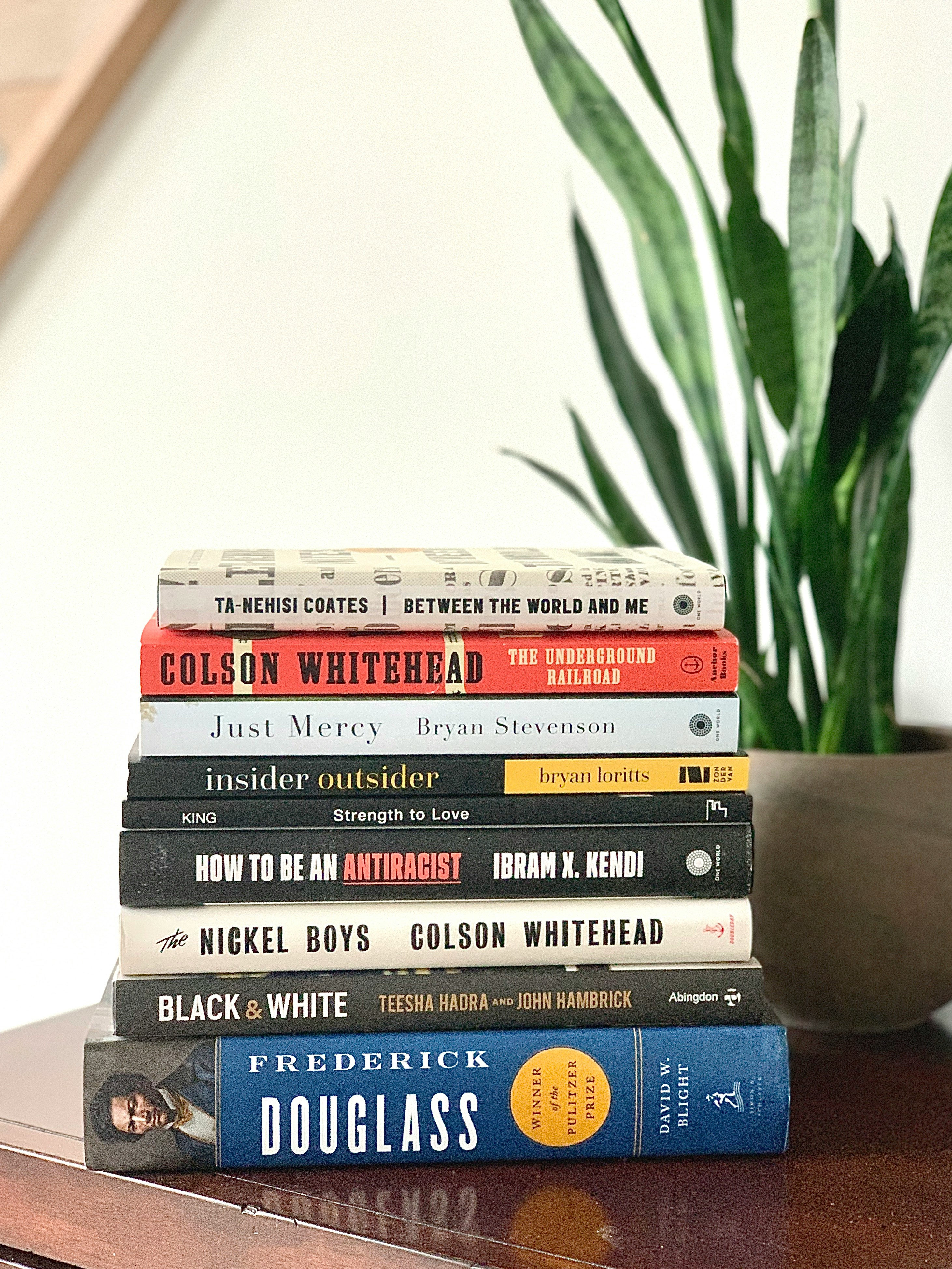 stack of books by black authors